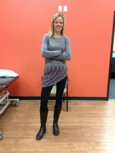 Crissy Ott standing with her pelvis oriented left as her trunk rotates to the right. She is trying to find her psychological and physiological balance in life.